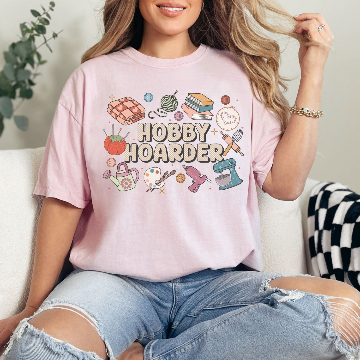 "Hobby Hoarder" graphic on soft pink (blossom) t-shirt.