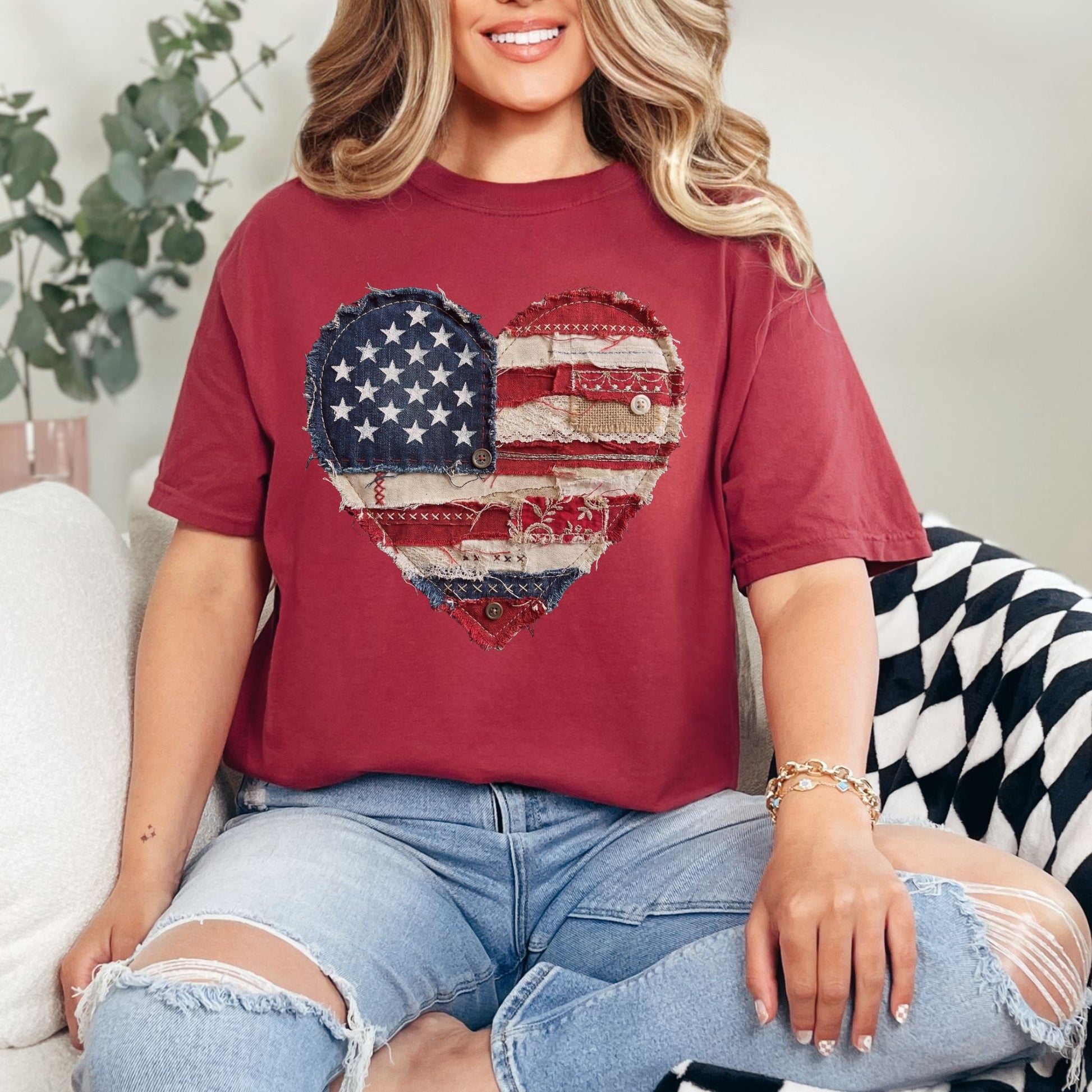 Model is wearing "American Heart Flag Faux Patchwork" graphic on muted brick red (chili) T-Shirt.
