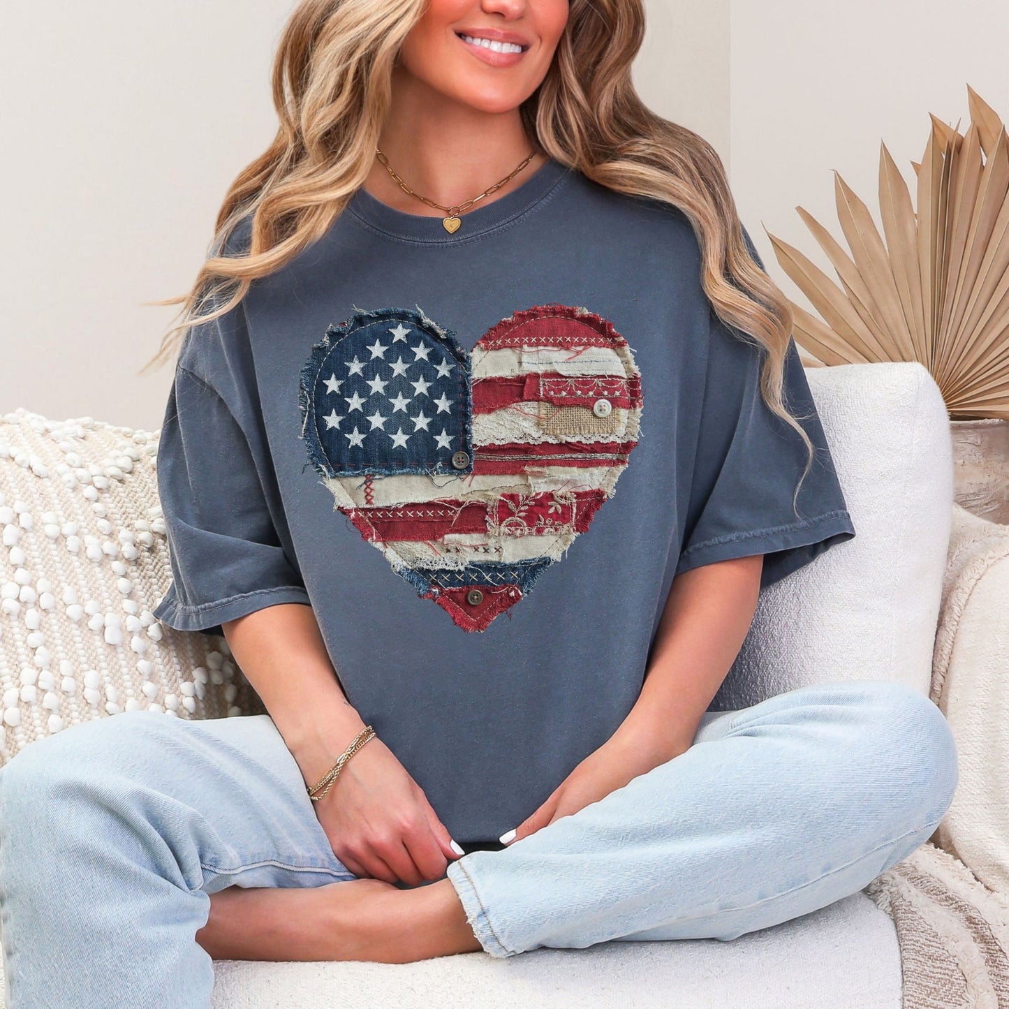 Model is wearing "American Heart Flag Faux Patchwork" graphic on muted medium blue (denim) T-Shirt.