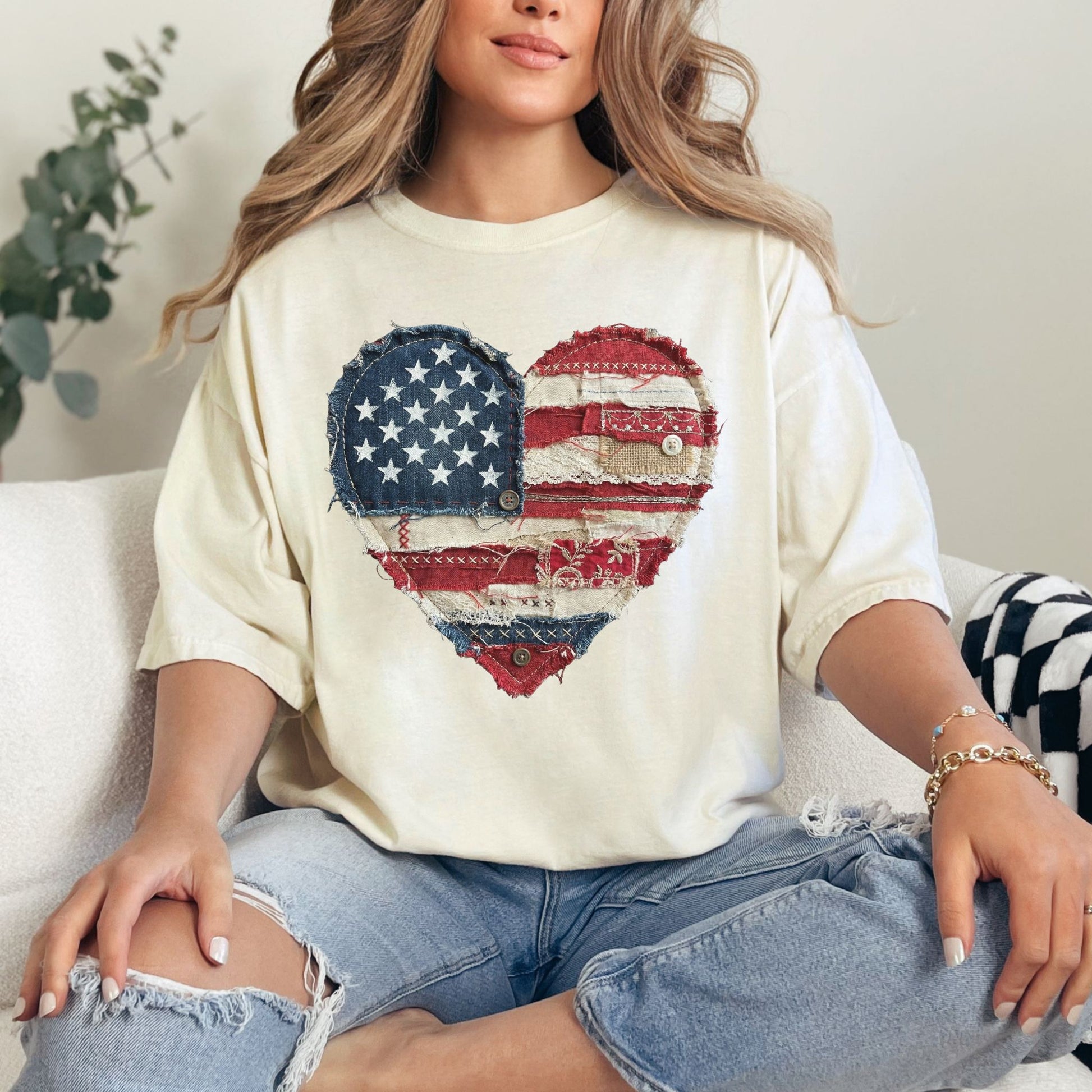 Model is wearing "American Heart Flag Faux Patchwork" graphic on soft off-white (ivory) T-Shirt.