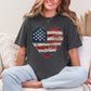 Model is wearing "American Heart Flag Faux Patchwork" graphic on dark charcoal gray (pepper) T-Shirt.
