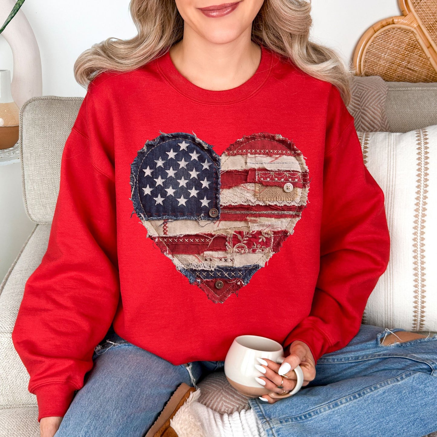 Model is wearing "American Heart Flag Faux Patchwork" graphic on true red (red) sweatshirt.