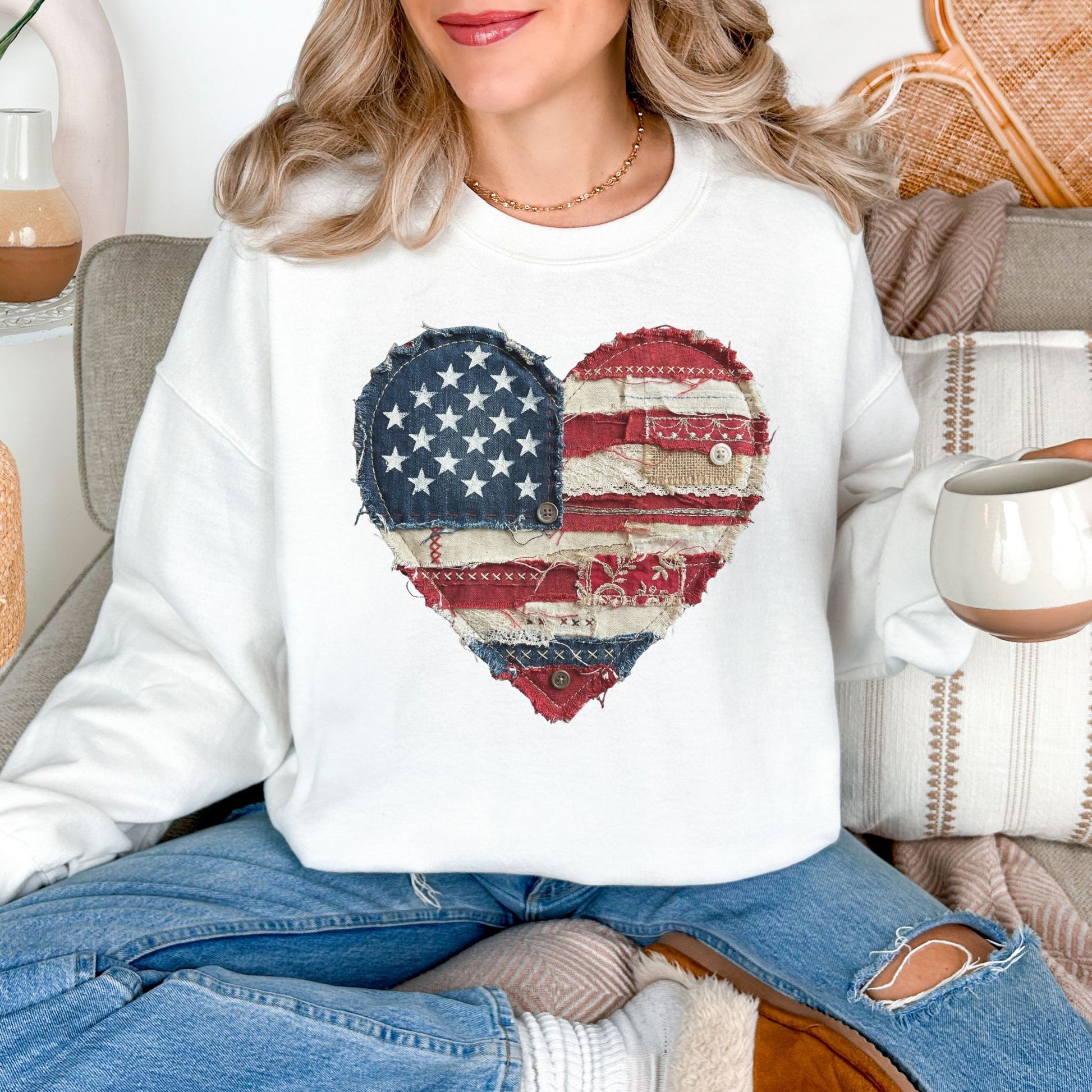 Model is wearing "American Heart Flag Faux Patchwork" graphic on a white sweatshirt.