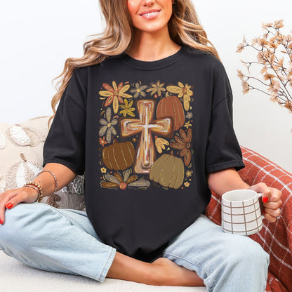 "Autumn pumpkin floral cross" graphic on black (very black) Comfort colors 1717 T-shirt.