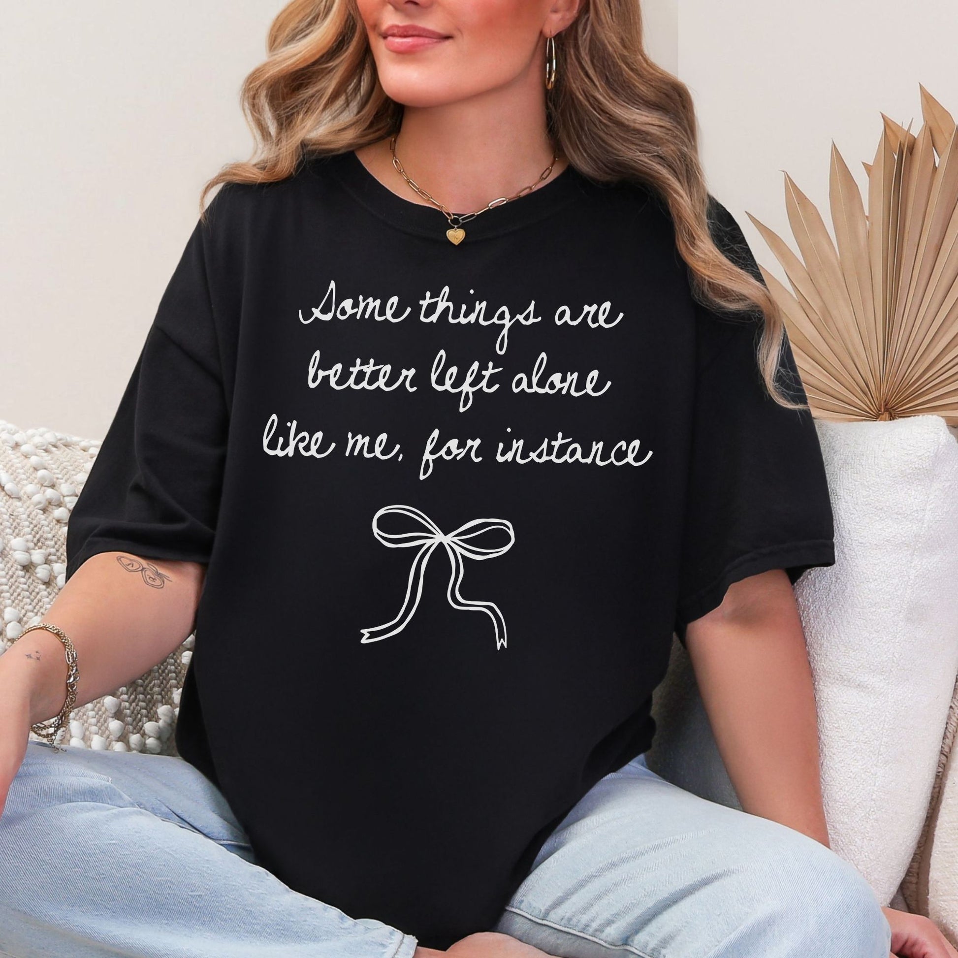 "Better Left Alone" graphic on Black a t-shirt.