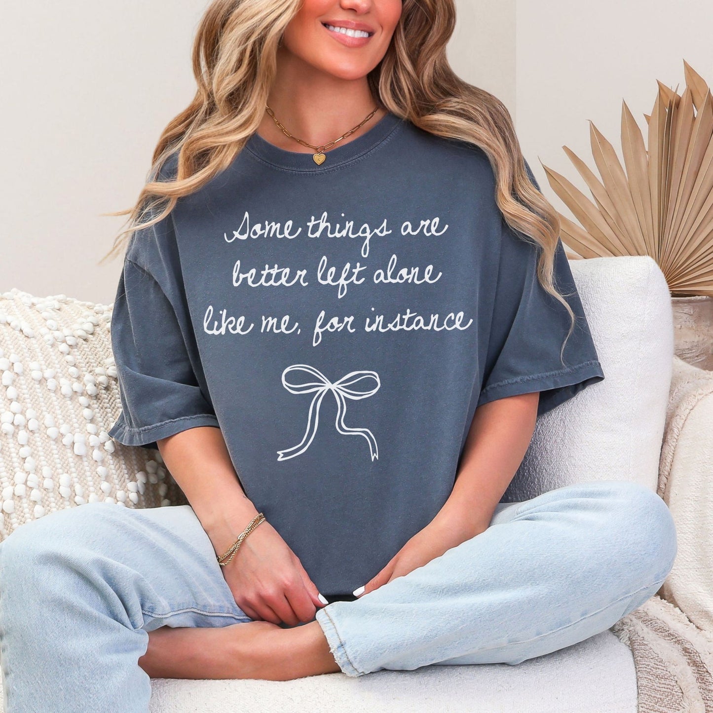 "Better Left Alone" graphic on muted medium blue (denim) t-shirt.