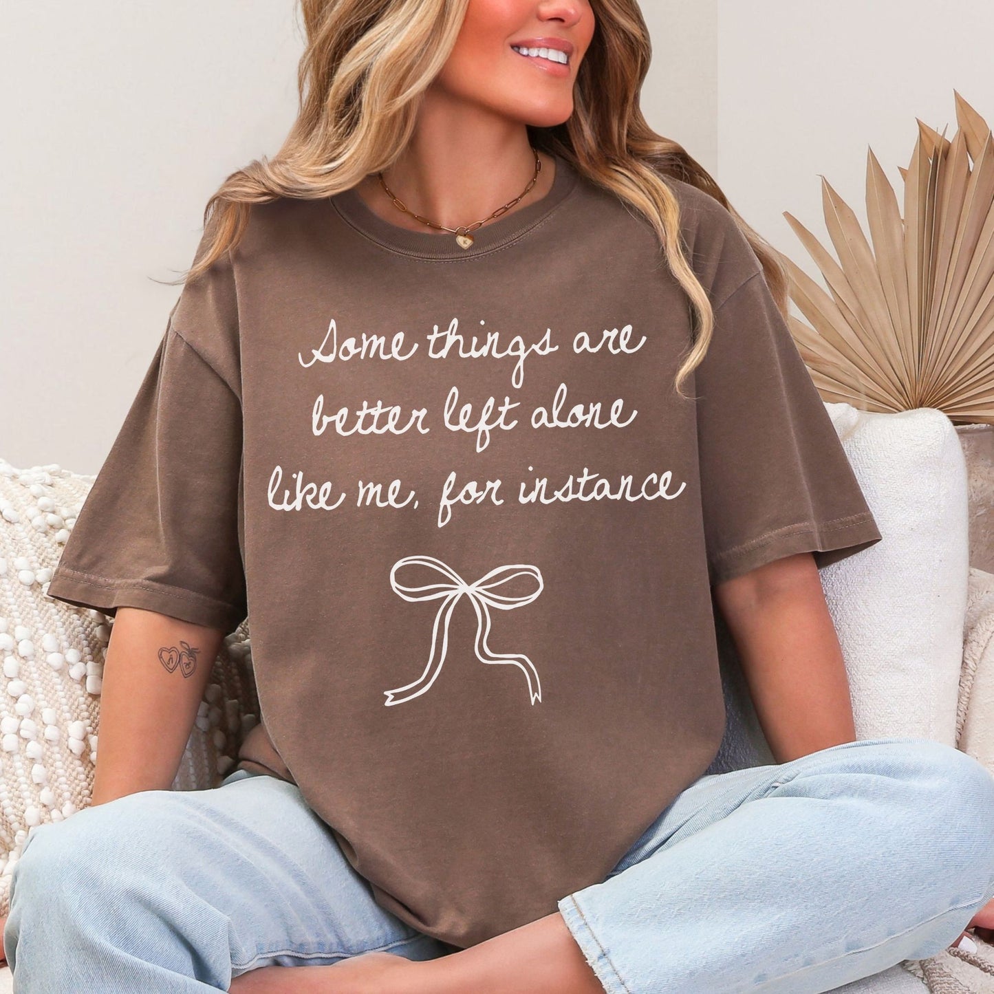 "Better Left Alone" graphic on a rich brown (espresso) t-shirt.