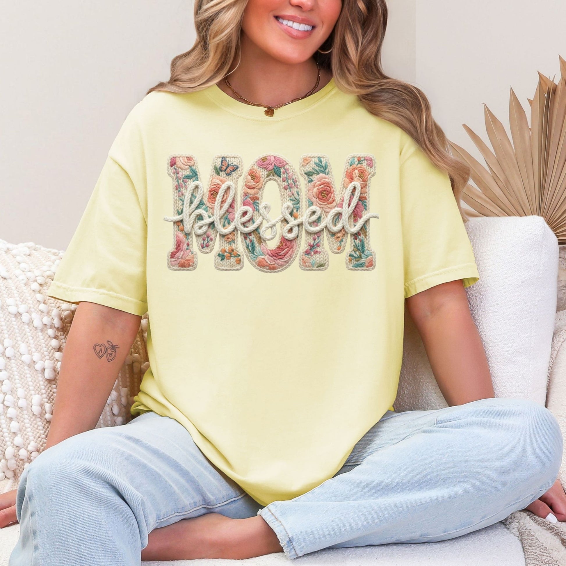 “Blessed Mom" graphic on soft pastel yellow (banana) t-shirt.
