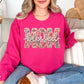 “Blessed Mom" graphic on bright pink (heliconia) sweatshirt.