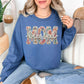 “Blessed Mom" graphic on deep muted blue (indigo blue) sweatshirt.