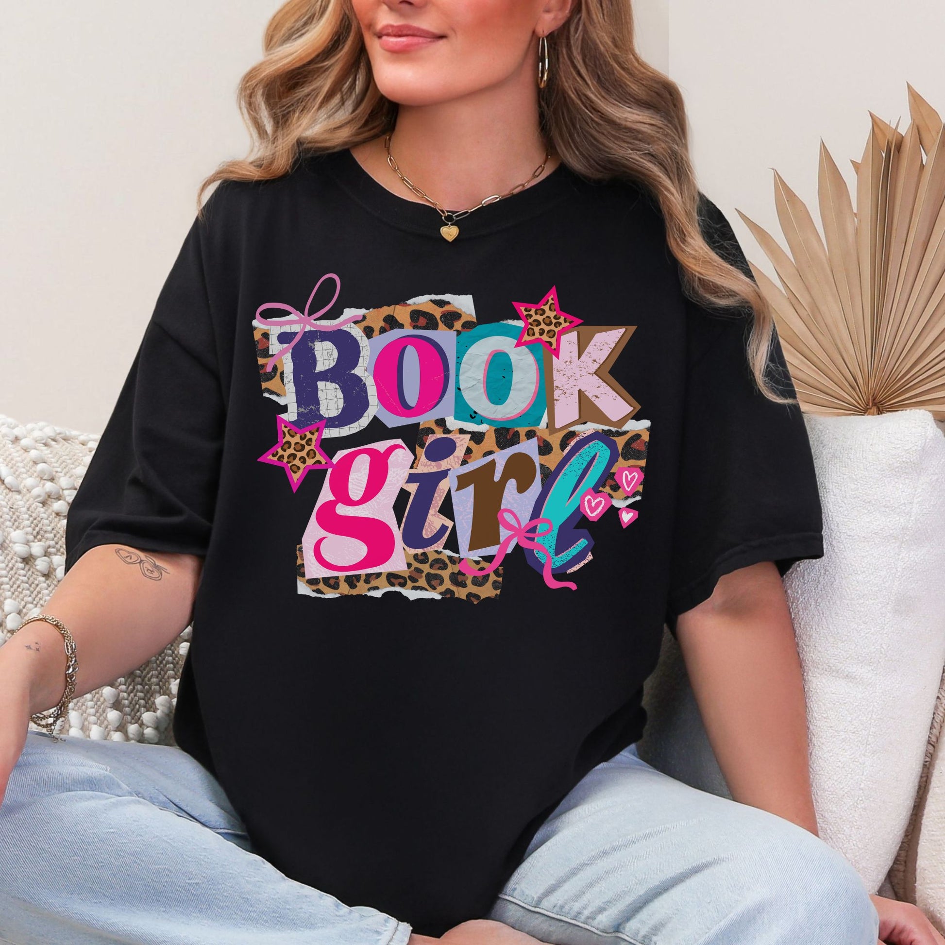 "Book Girl" collage graphic in a black T-shirt
