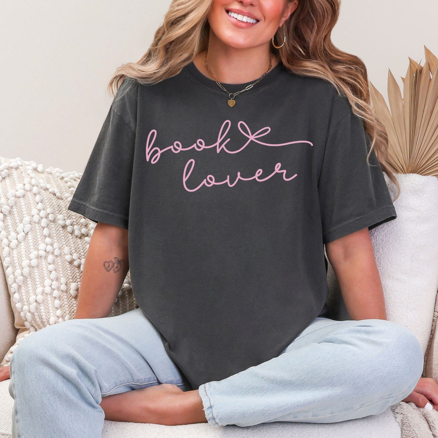 "Book Lover" graphic on dark charcoal gray (pepper) T-shirt.