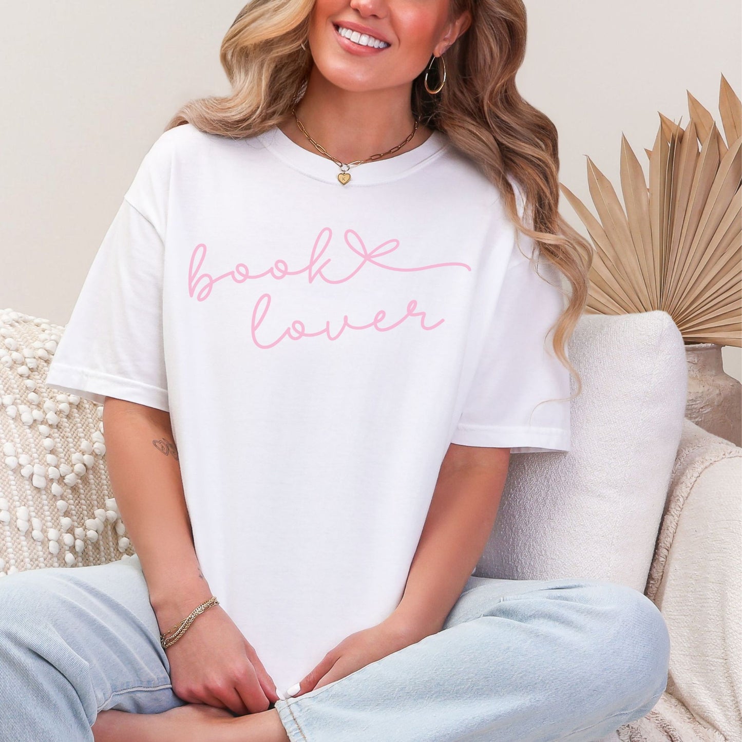 "Book Lover" graphic on bright white (white) T-shirt.