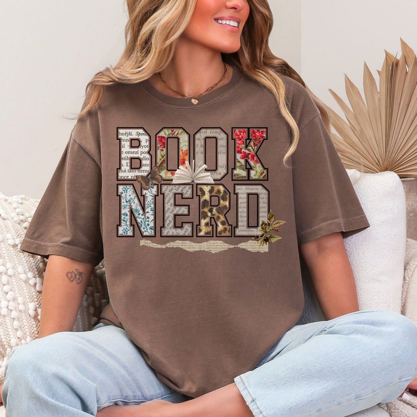 "Book Nerd" graphic on a rich brown (espresso) t-shirt.