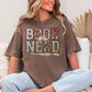 "Book Nerd" graphic on a rich brown (espresso) t-shirt.