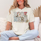 "Book Nerd" graphic on a soft off-white (ivory) t-shirt.