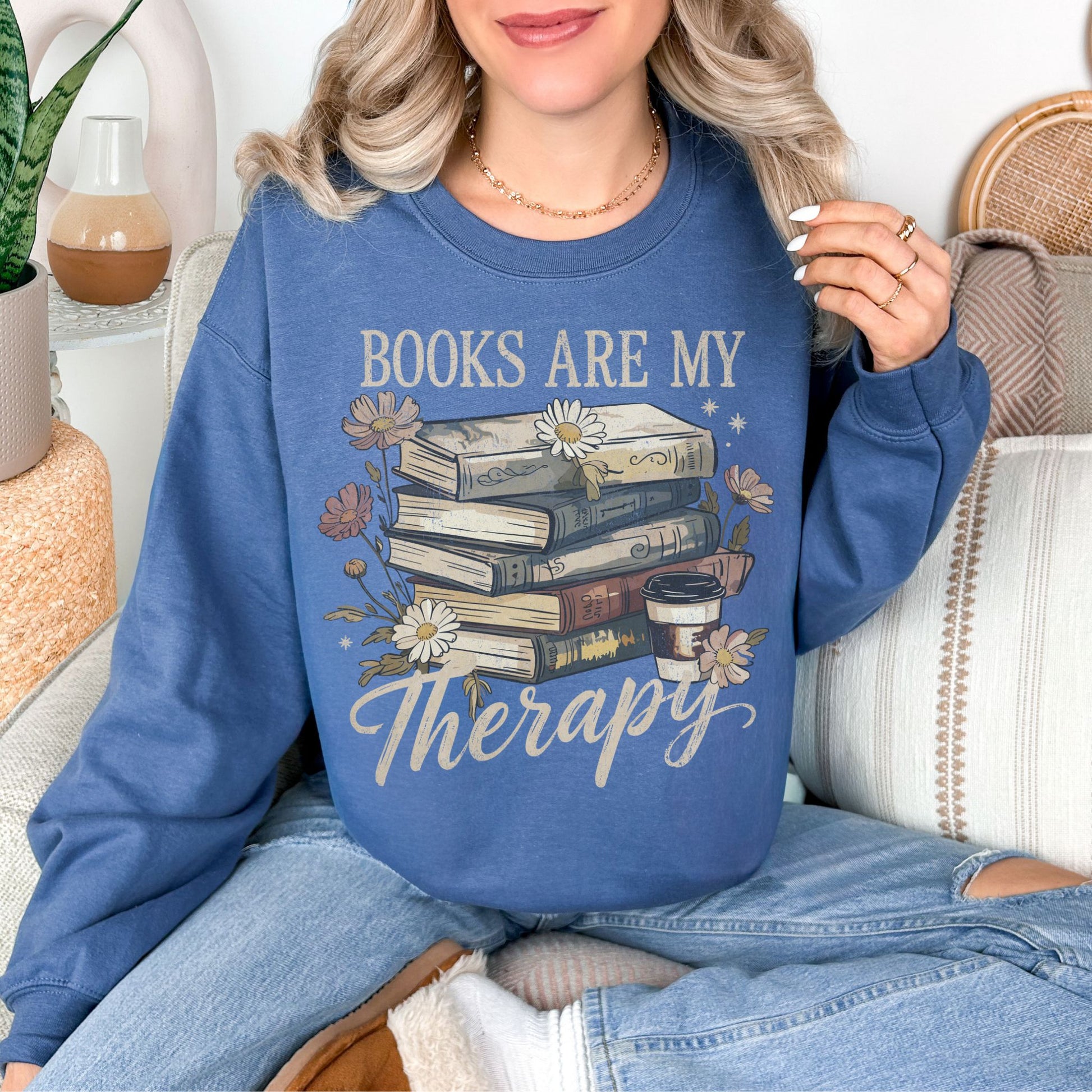 “Books are my therapy" graphic on rich medium-dark blue (indigo blue) Sweatshirt