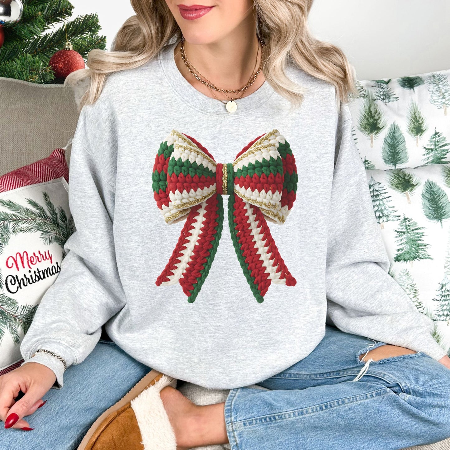 "Christmas Faux Crochet Bow" Design graphic on a very light gray (ash) sweatshirt.