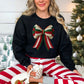 "Christmas Faux Crochet Bow" Design graphic on a black sweatshirt.