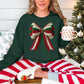 "Christmas Faux Crochet Bow" Design graphic on a dark green (forest green) sweatshirt.