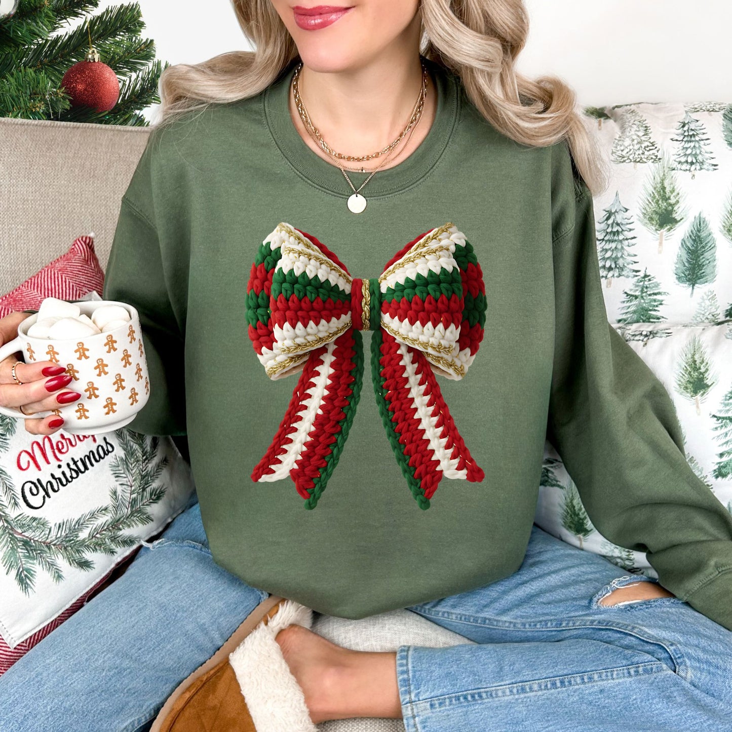 "Christmas Faux Crochet Bow" Design graphic on a muted olive green (military green) sweatshirt.