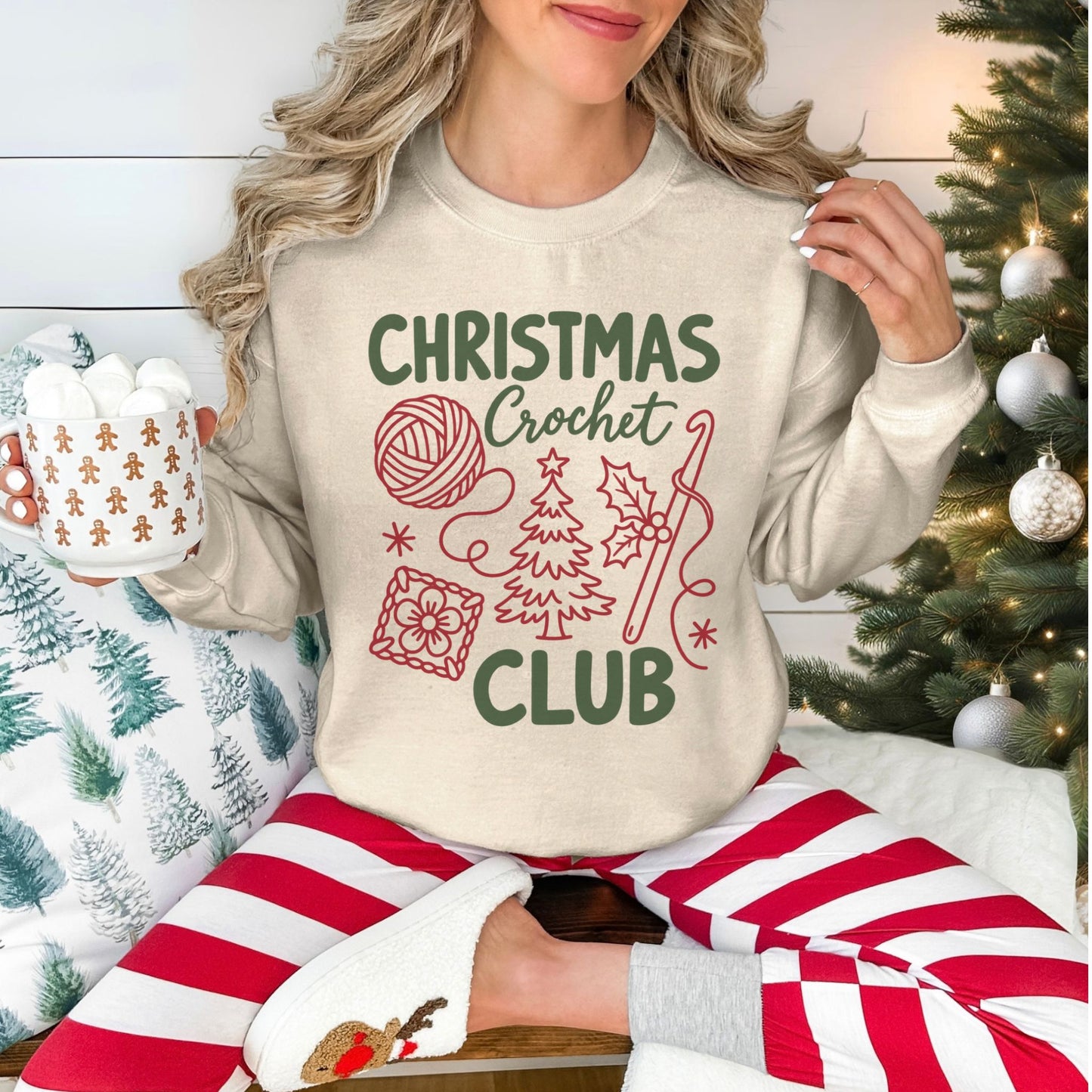 "Christmas Crochet Club" graphic on a Gildan 18000 sweatshirt in the color very light beige (sand).