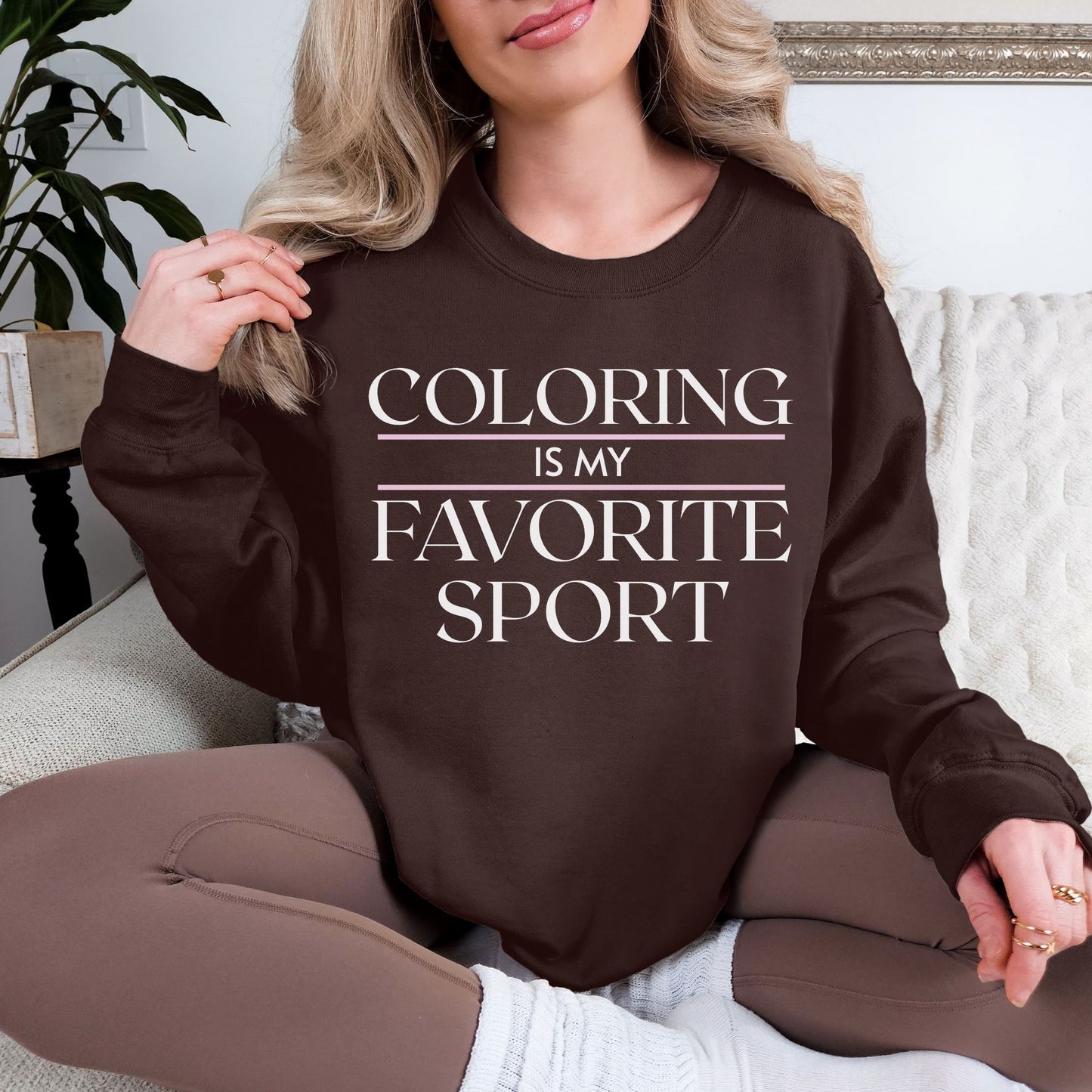 "Coloring Favorite Sport" graphic on deep dark brown (dark chocolate) sweatshirt.