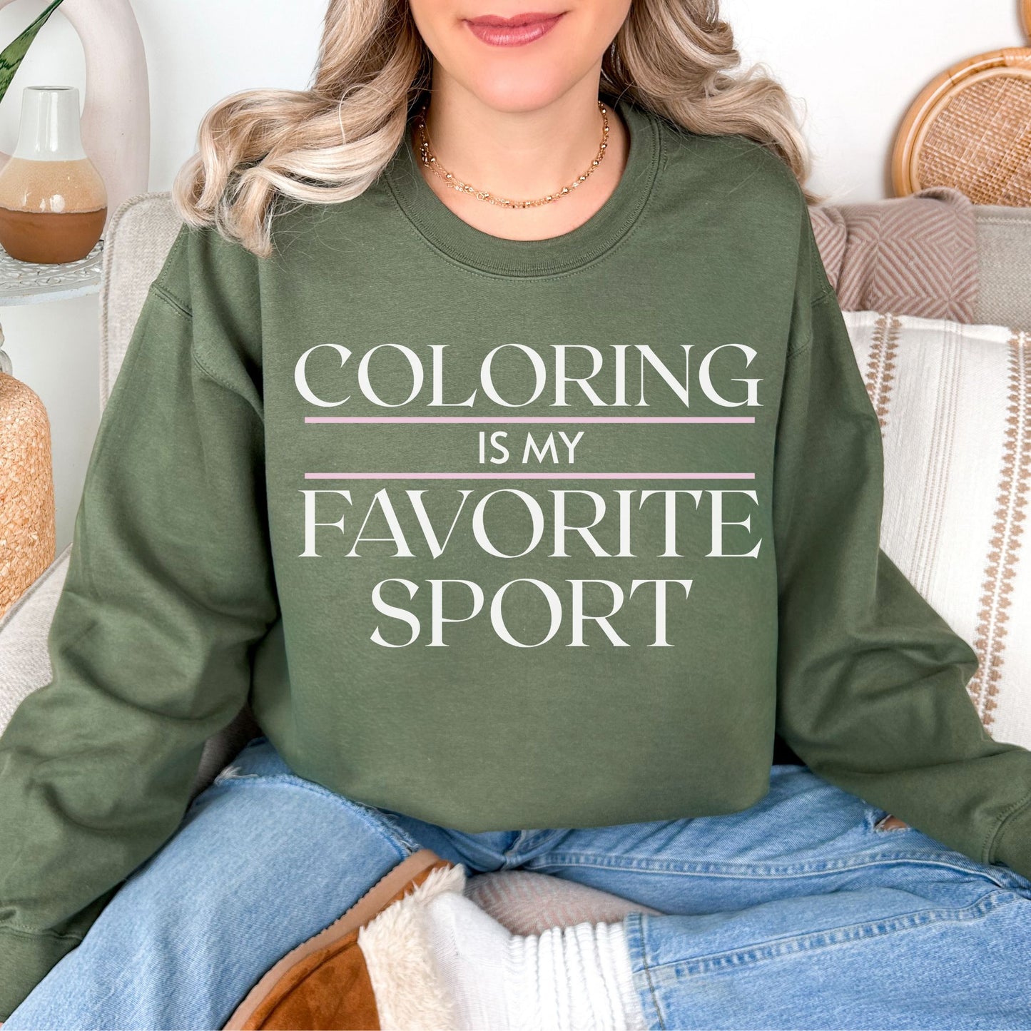 "Coloring Favorite Sport" graphic on muted olive green (military green) sweatshirt.