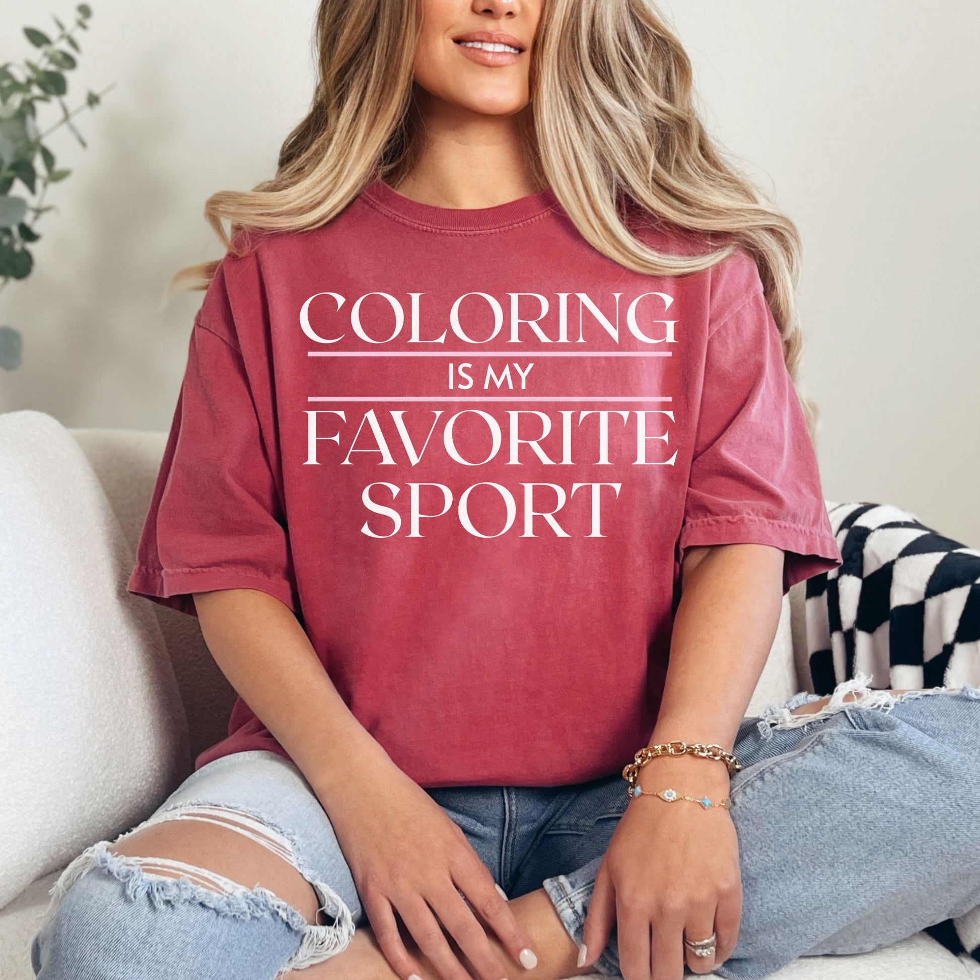"Coloring is my favorite sport" graphic on deep muted red (crimson) T shirt. 