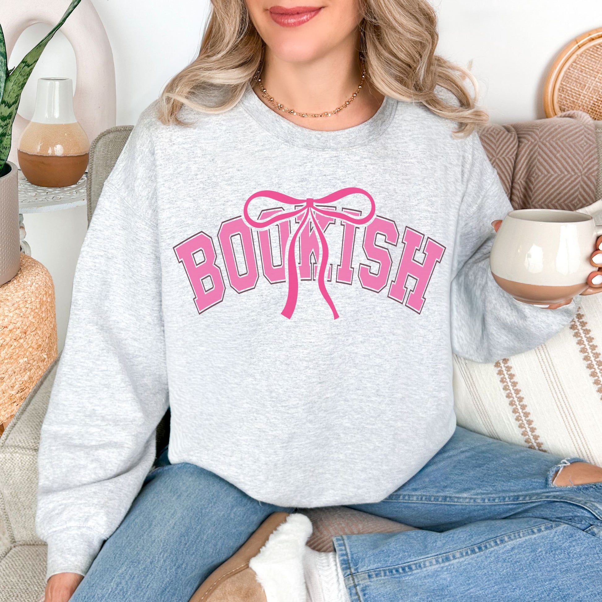 "Coquette Bookish" graphic on very light gray (ash) Sweatshirt.