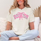 "Coquette Bookish" graphic on soft off-white (ivory) t-shirt.