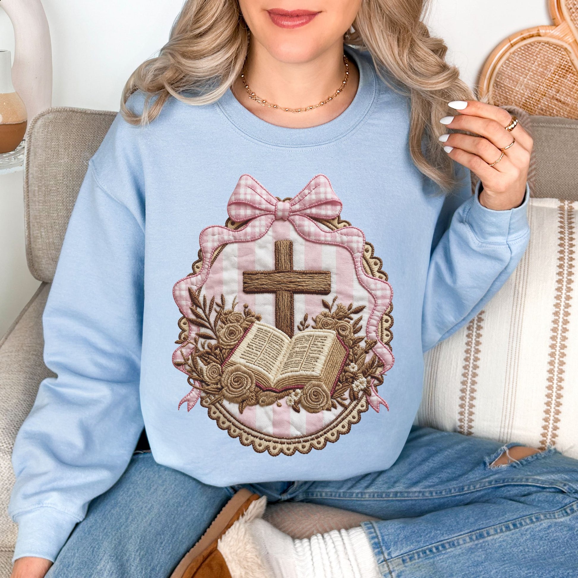 "Coquette Faux Embroidery Bible and Cross" graphic on pale soft blue (light blue) Sweatshirt
