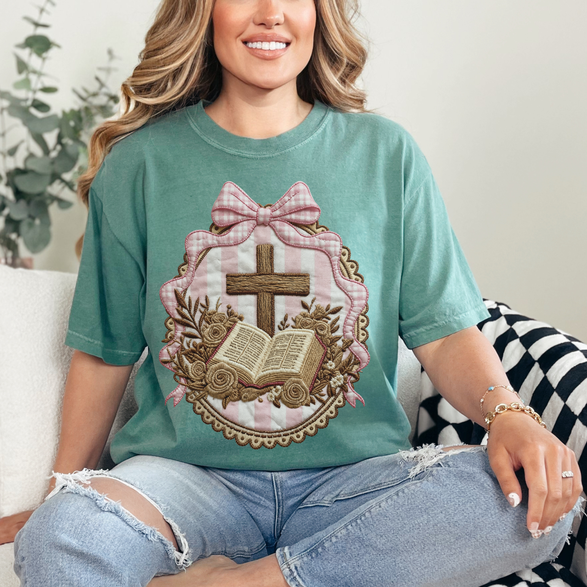 "Coquette Faux Embroidery Bible and Cross" graphic on soft light green (light green) T-Shirt. 