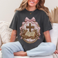 "Coquette Faux Embroidery Bible and Cross" graphic on dark charcoal gray (pepper) T-Shirt. 