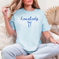 "Couquette Homebody" graphic in a soft medium blue (chambray) T-shirt.