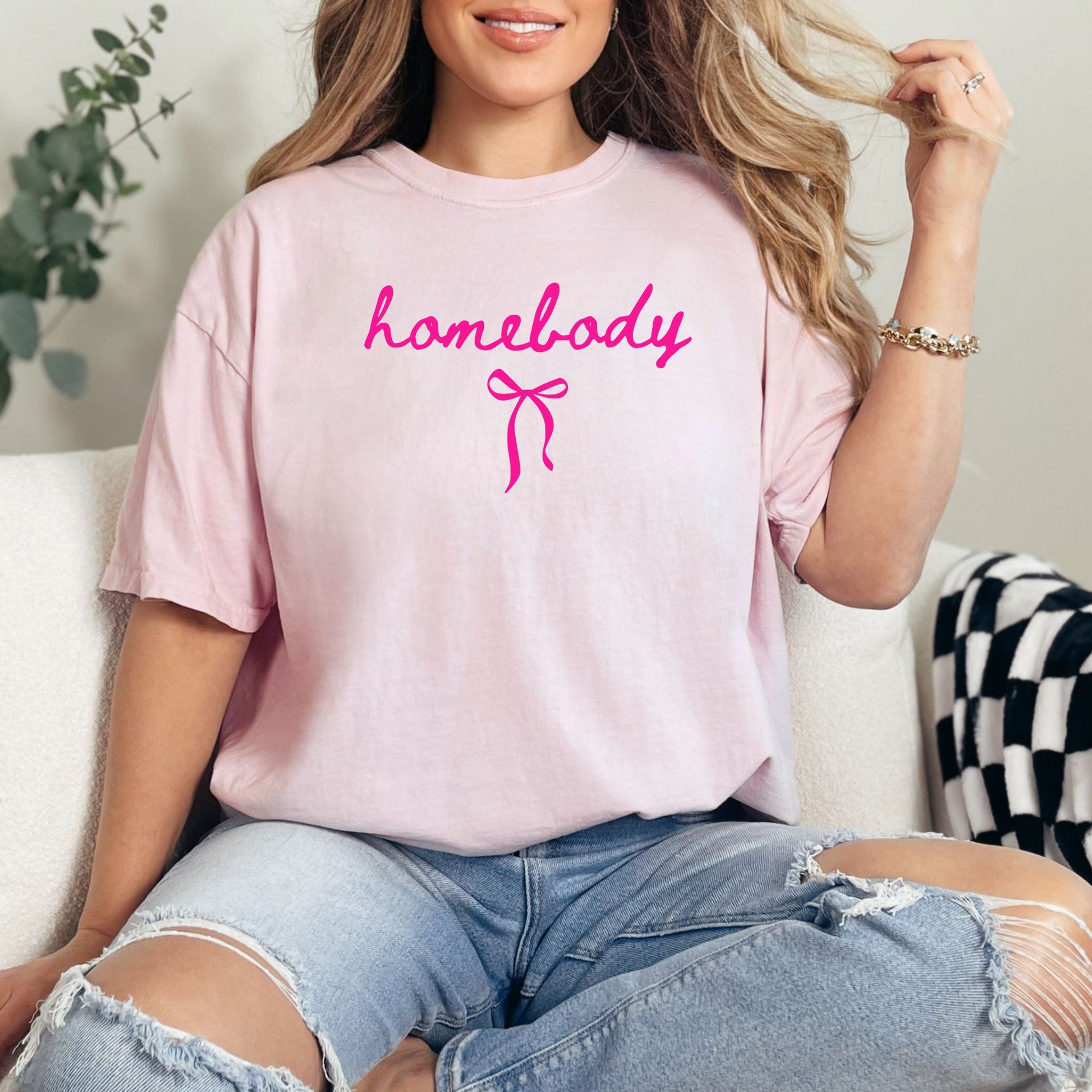 Couquette Homebody graphic in a soft pink (Blossom) T-shirt.