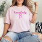 Couquette Homebody graphic in a soft pink (Blossom) T-shirt.