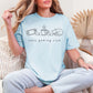 "Cozy gaming club" graphic on soft medium blue (chambray) t-shirt.