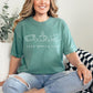 "Cozy gaming club" graphic on soft light green (light green) t-shirt.