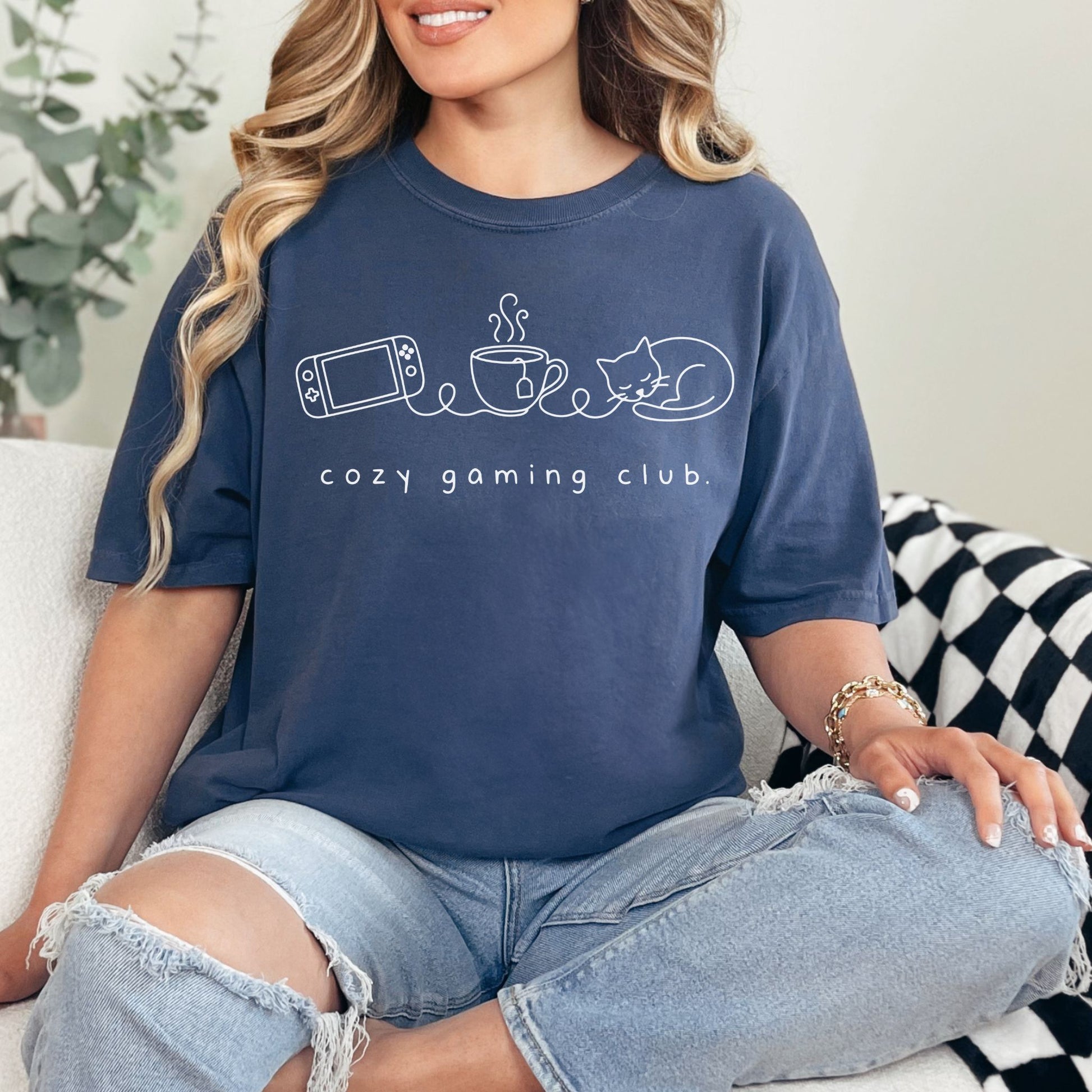 "Cozy gaming club" graphic on deep navy blue (navy) t-shirt.