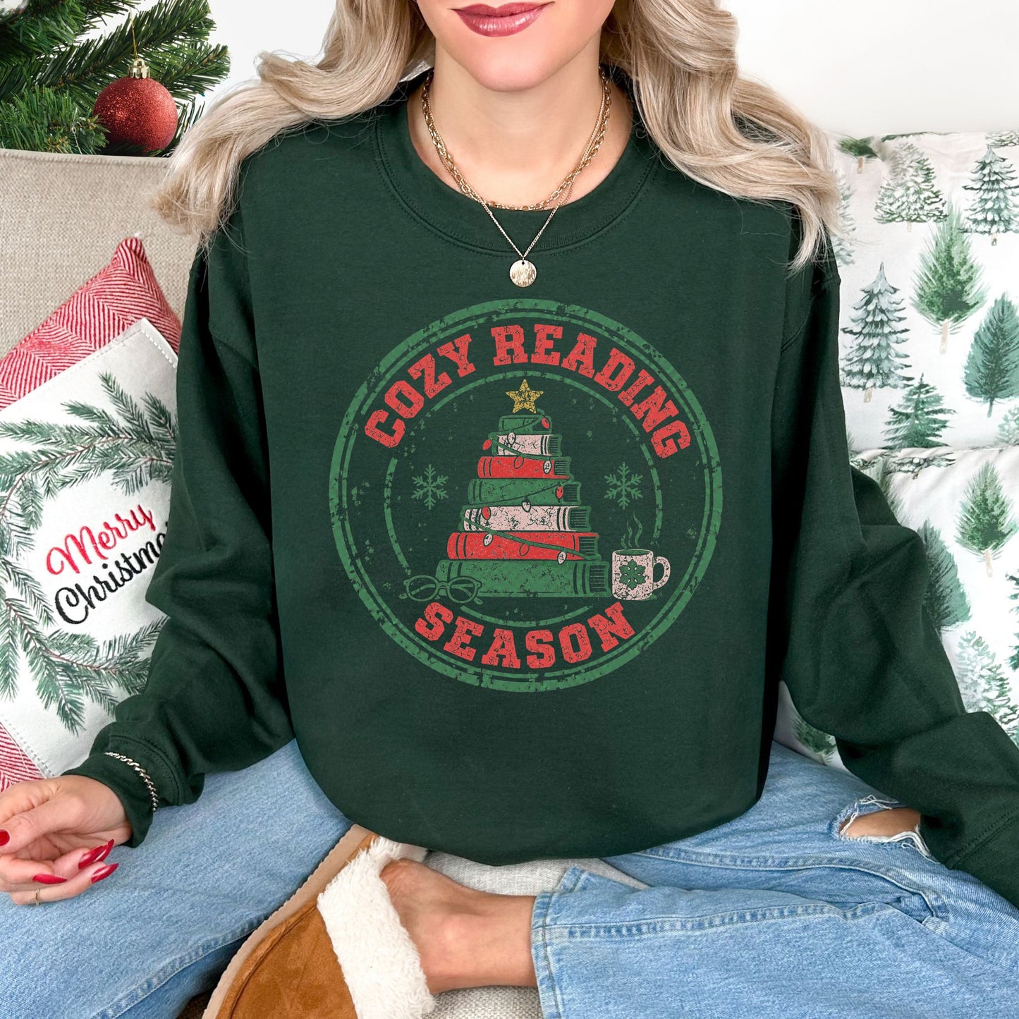 "Distressed Cozy Reading Season" graphic on a Gildan 18000 Sweatshirt in dark green (forest green).