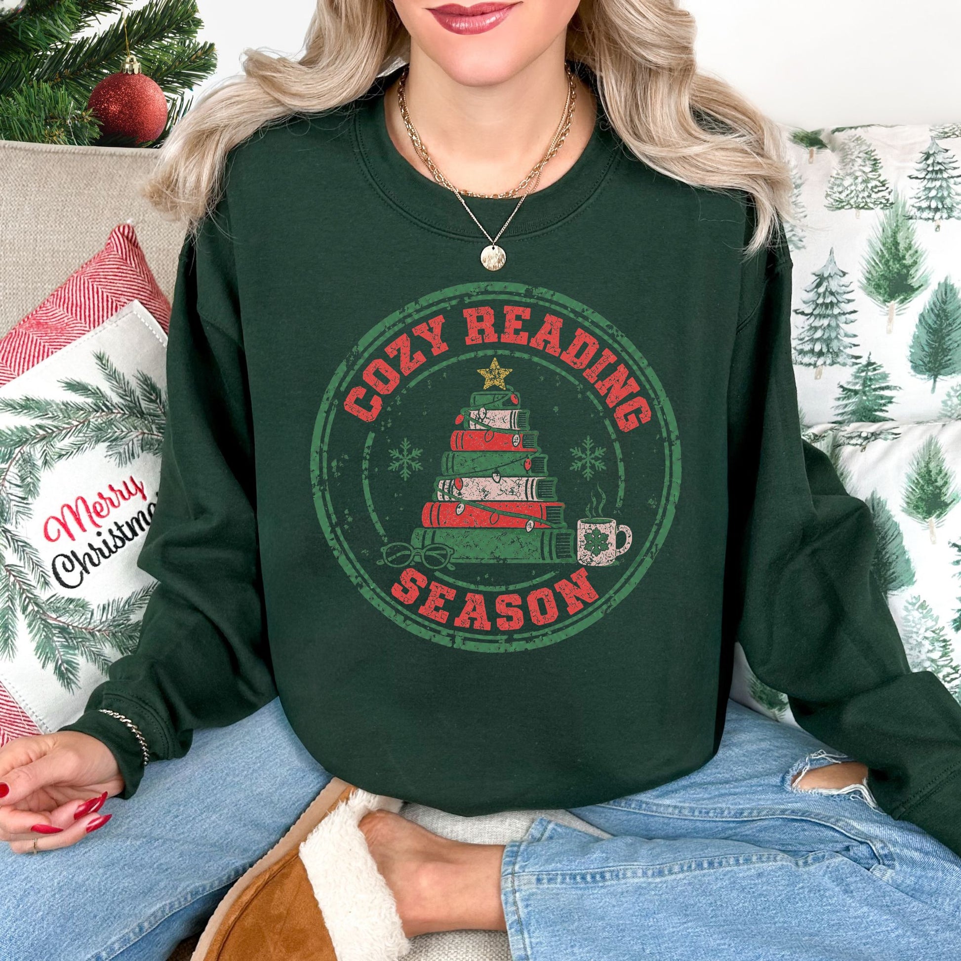 "Distressed Cozy Reading Season" graphic on a Gildan 18000 Sweatshirt in dark green (forest green).