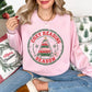 "Distressed Cozy Reading Season" graphic on a Gildan 18000 Sweatshirt in soft pale pink (light pink).