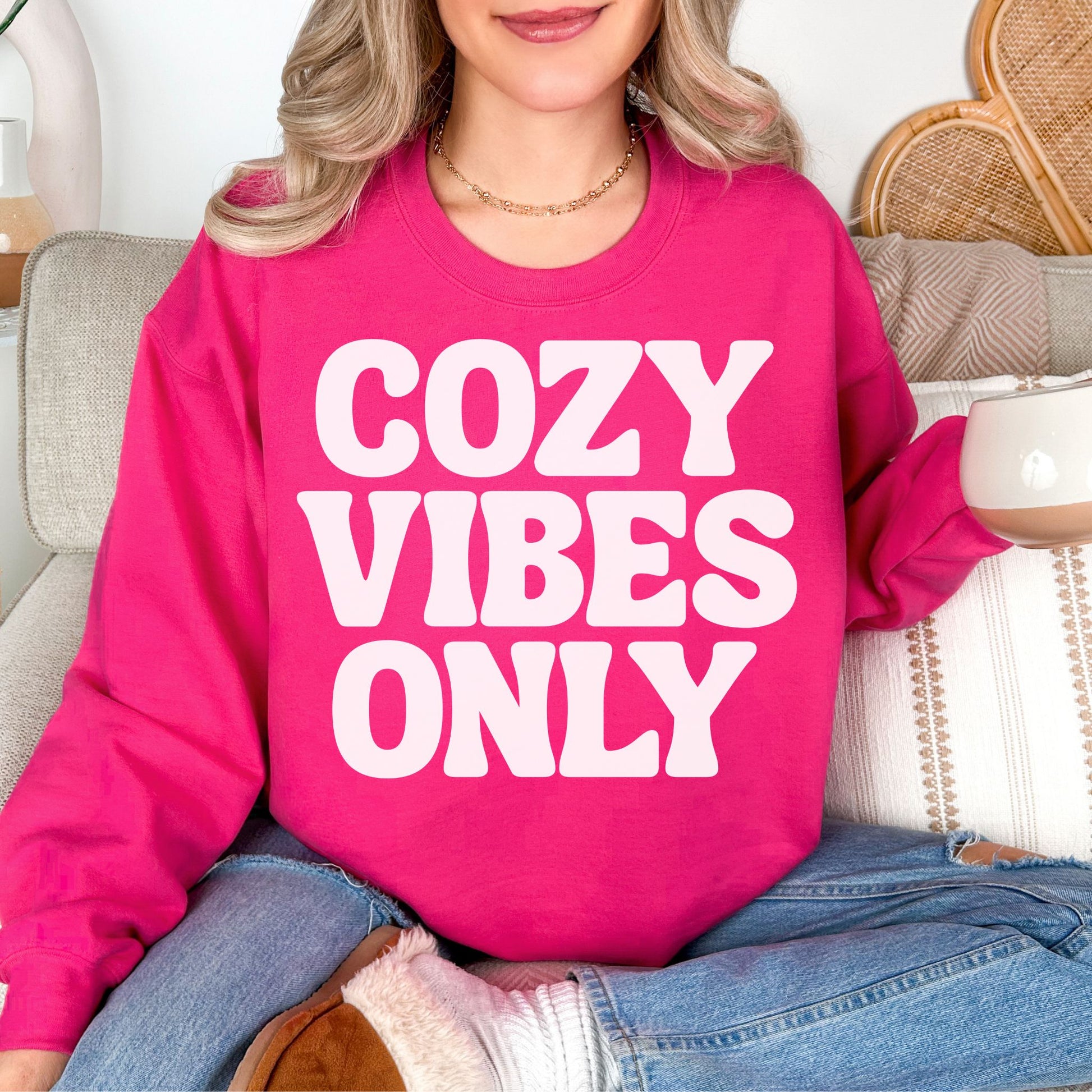 "Cozy Vibes Only" graphic bright pink (heliconia) Sweatshirt.