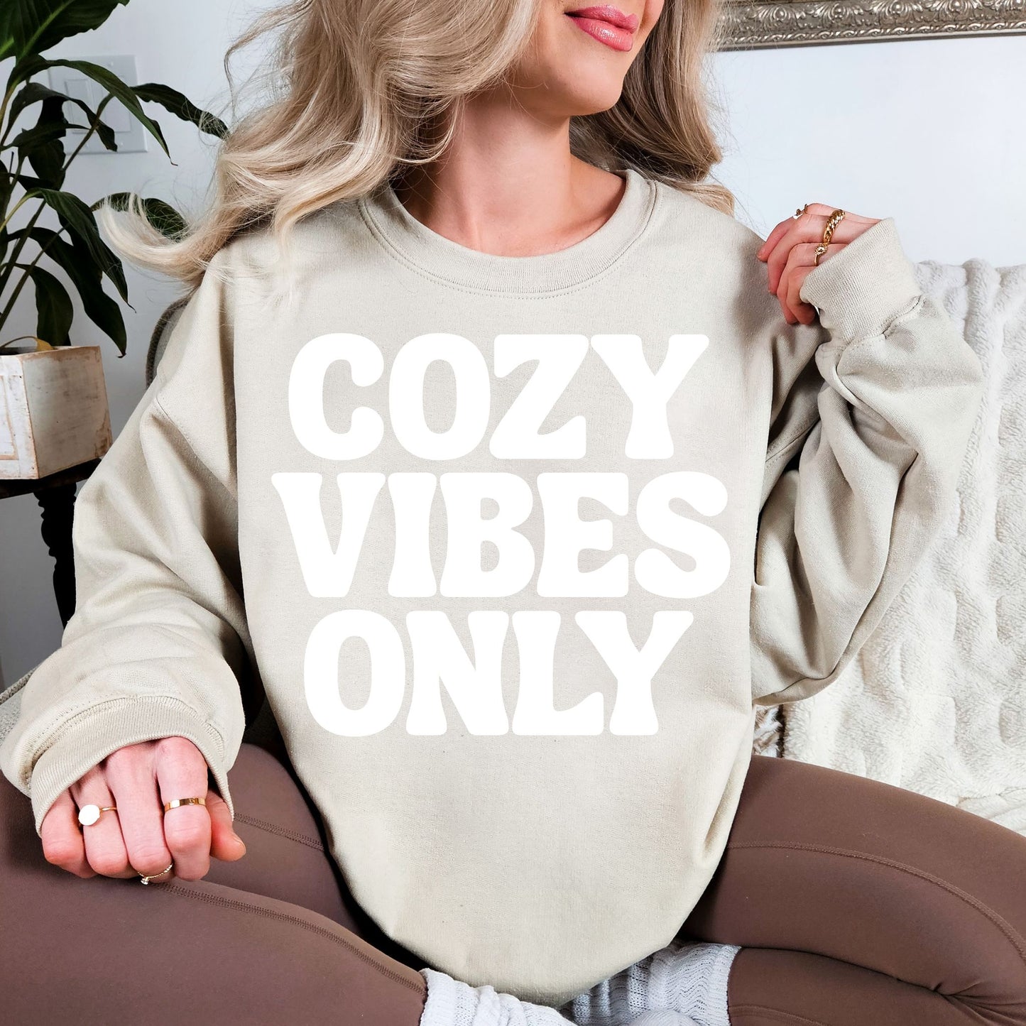 "Cozy Vibes Only" graphic on light warm beige (sand) Sweatshirt.