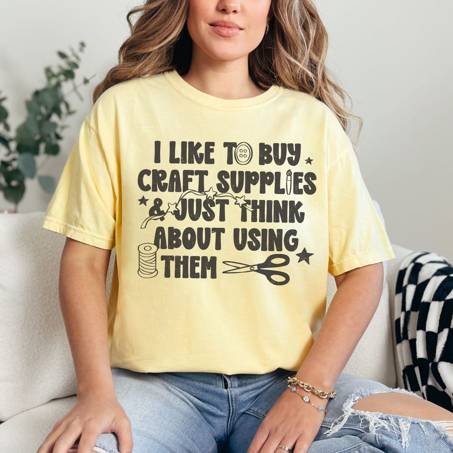 "I like to buy craft Supplies and just think about using them graphic on soft yellow (butter) shirt.