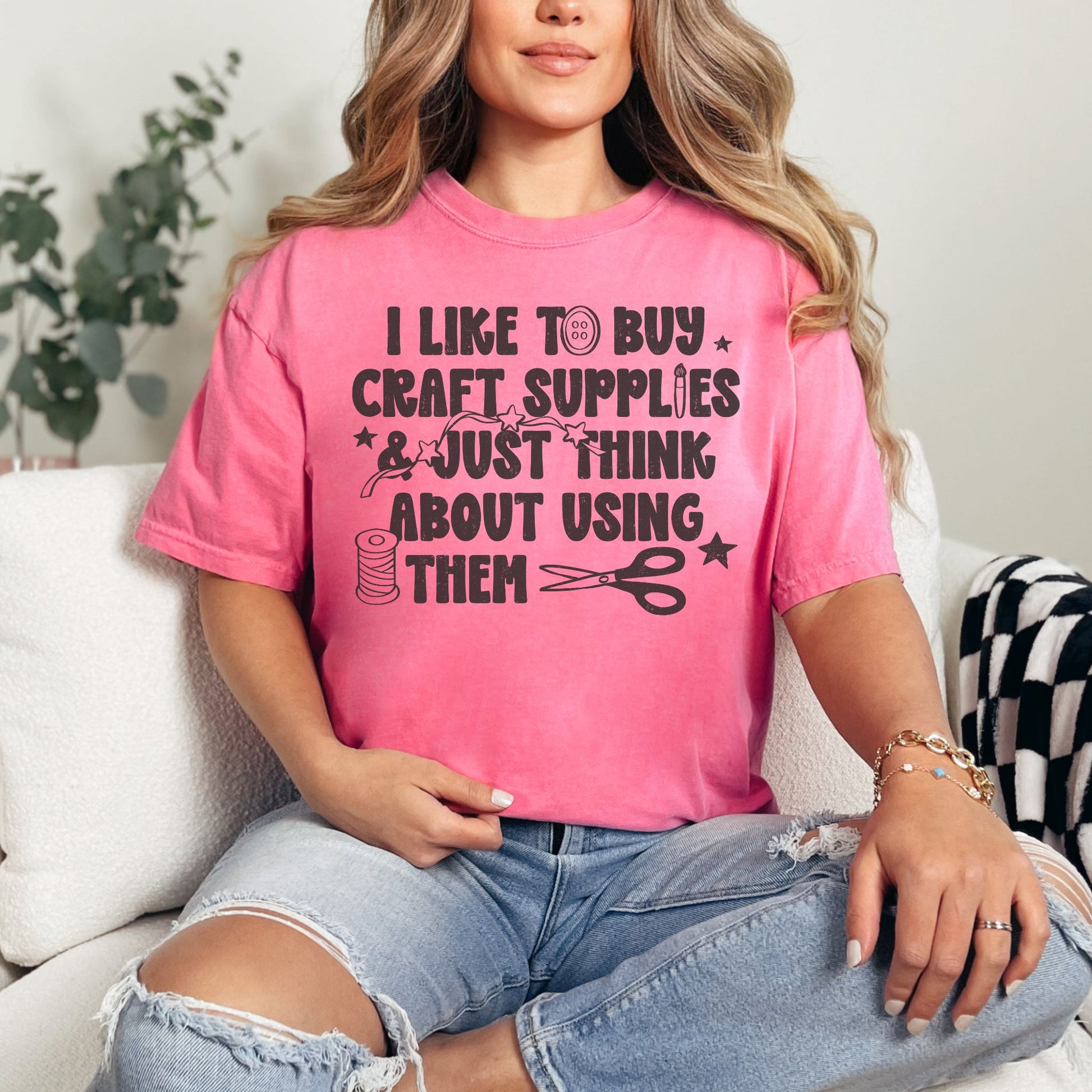 "I like to buy craft Supplies and just think about using them graphic on bright raspberry pink (crunchberry) shirt.