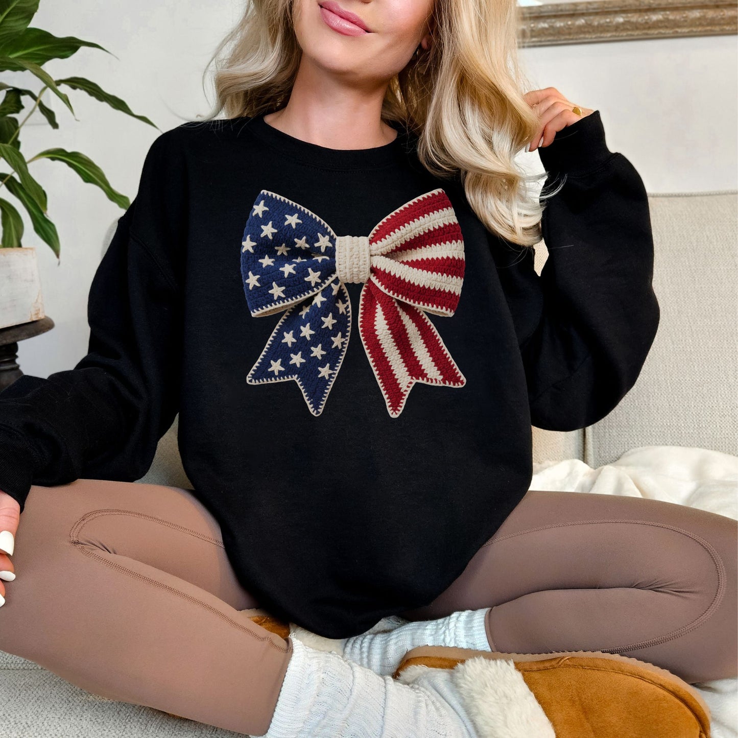 "Faux Crochet American Flag Bow" graphic on black sweatshirt.