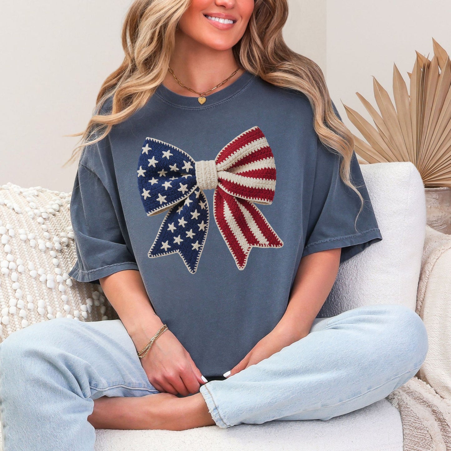 Faux Crochet American Flag Bow" graphic on muted medium blue (denim) T-Shirt.
