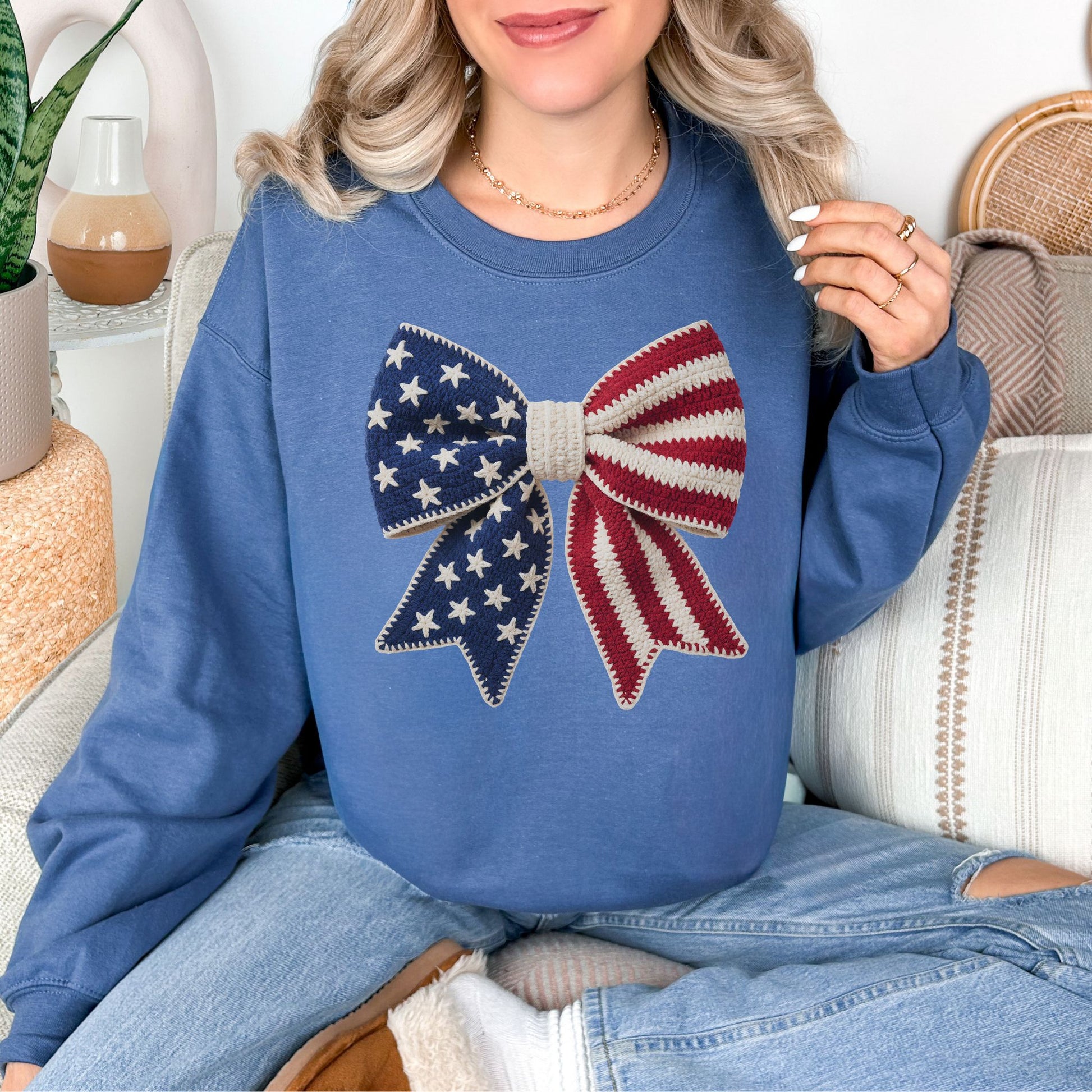 "Faux Crochet American Flag Bow" graphic deep muted blue (indigo blue) sweatshirt.